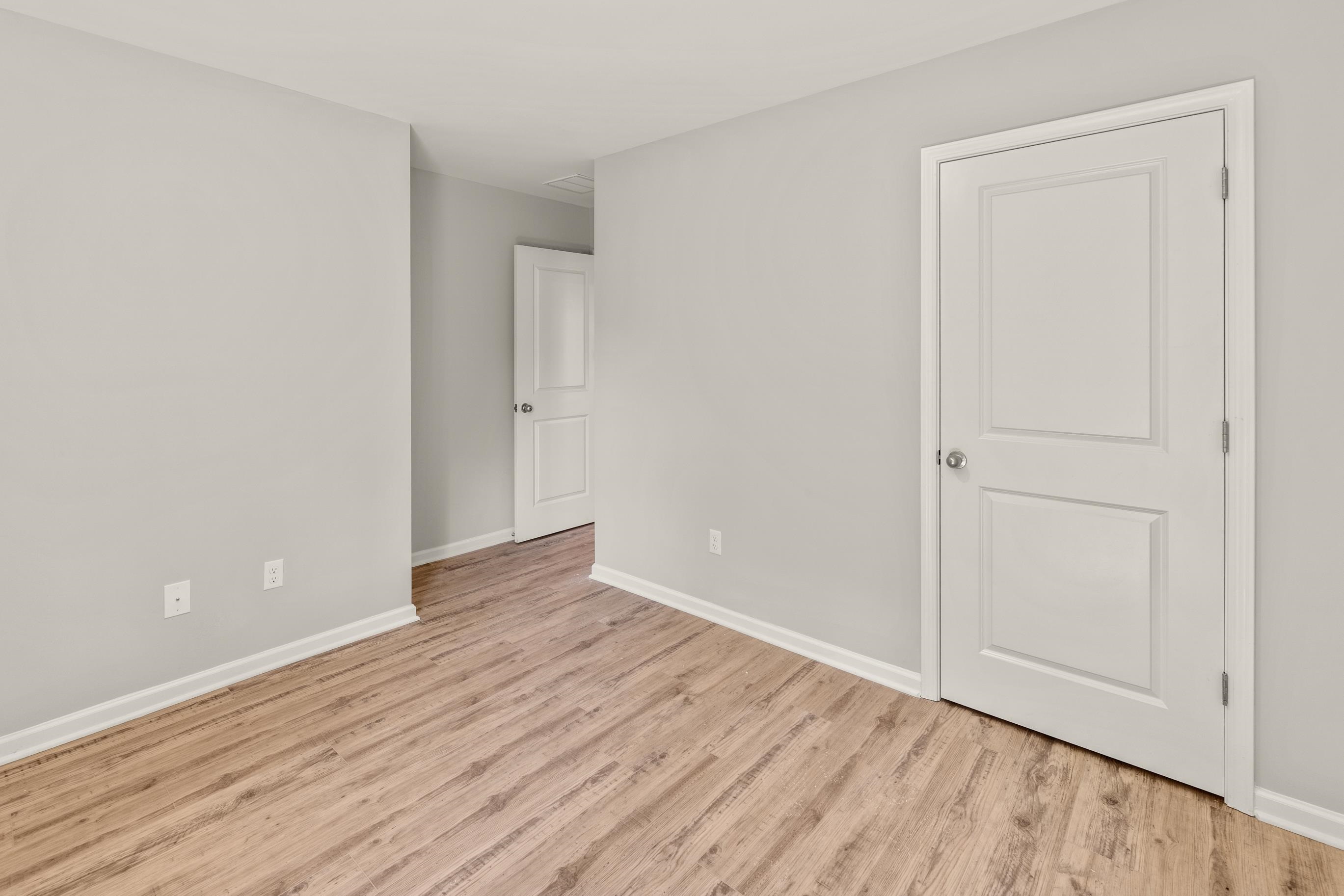 5279 Zodiac Road Memphis, TN 38118 - Photo 20 of 22 a view of an empty room with wooden floor