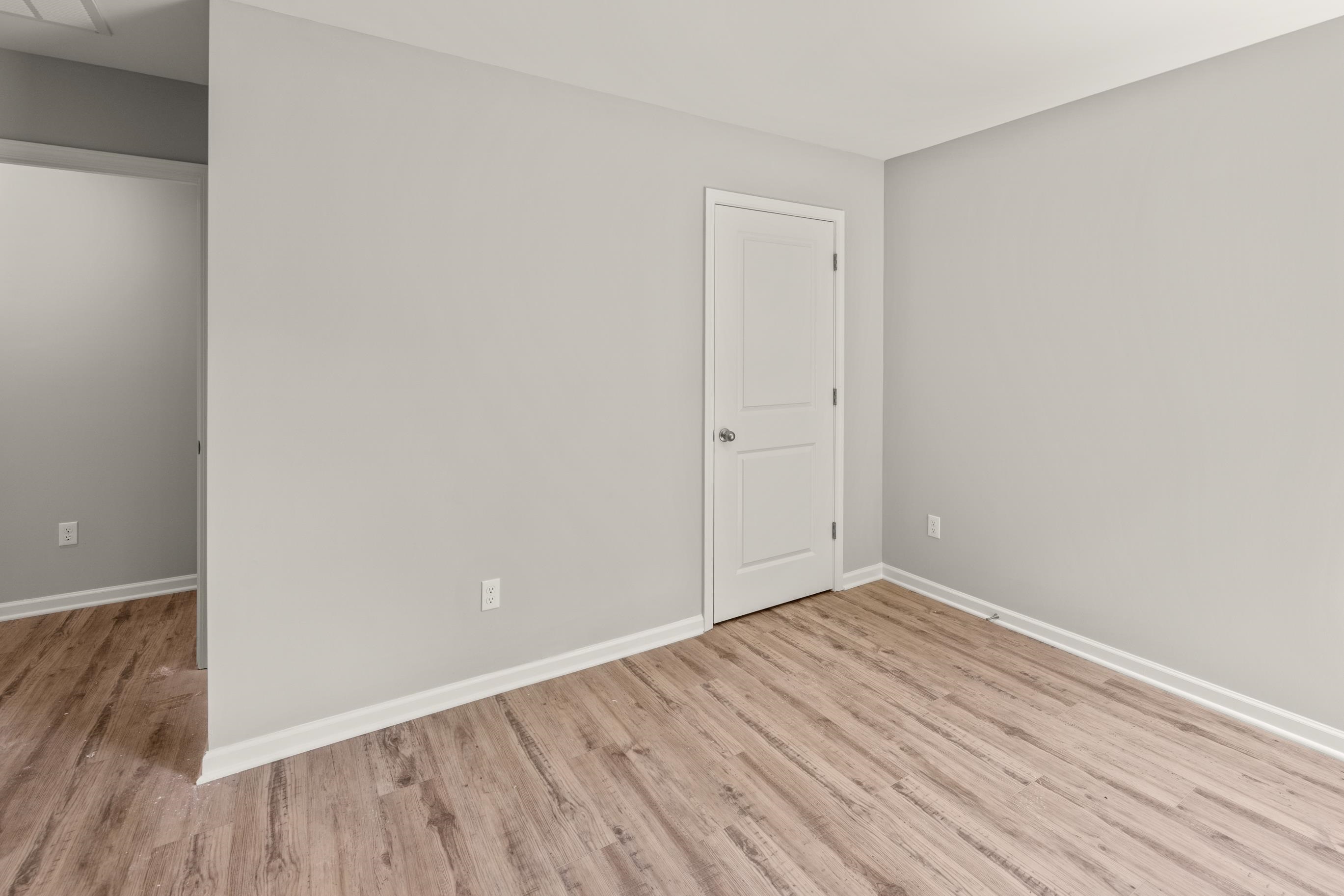 5279 Zodiac Road Memphis, TN 38118 - Photo 21 of 22 a view of an empty room with wooden floor