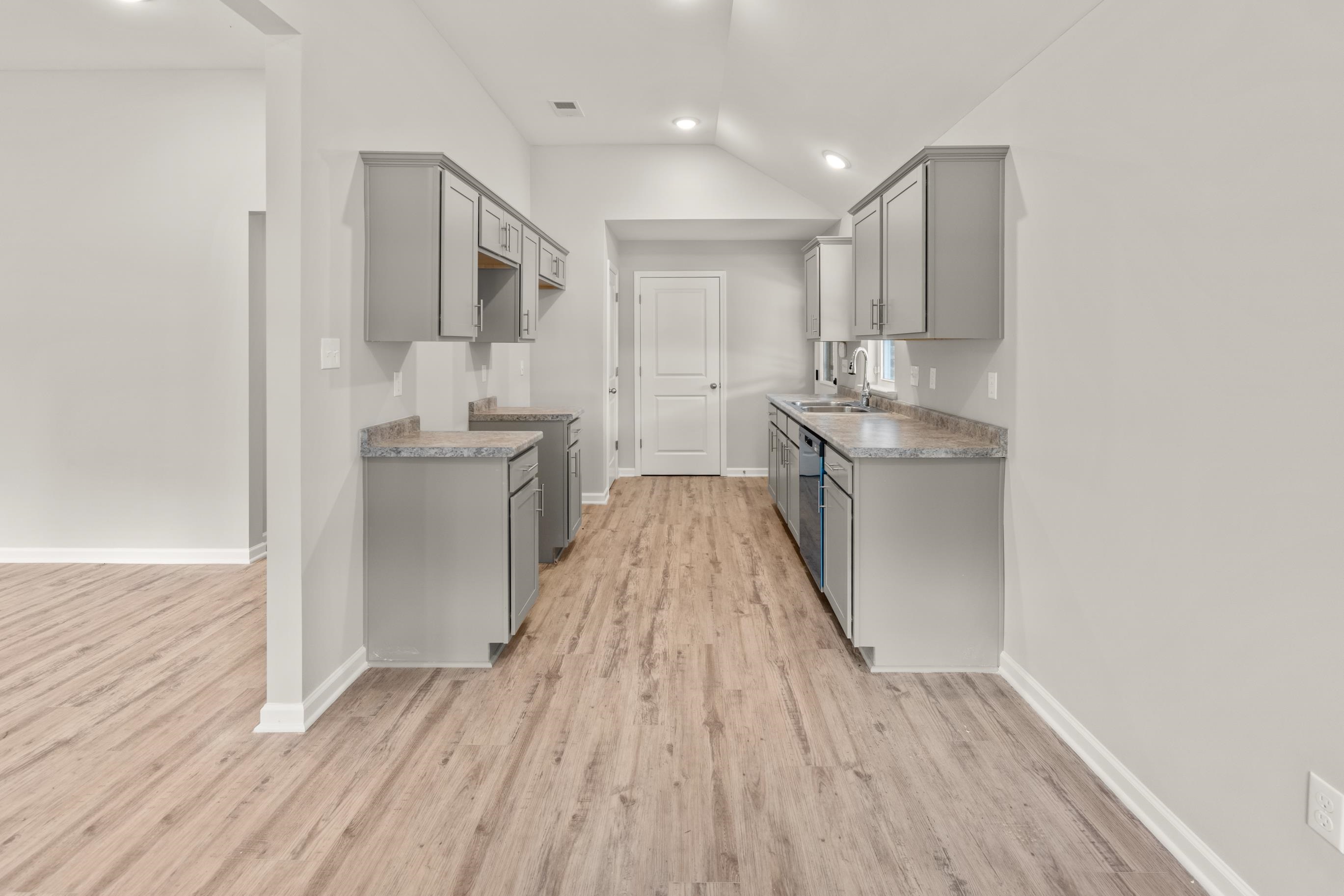 5279 Zodiac Road Memphis, TN 38118 - Photo 9 of 22 a kitchen with stainless steel appliances granite countertop a stove and a refrigerator
