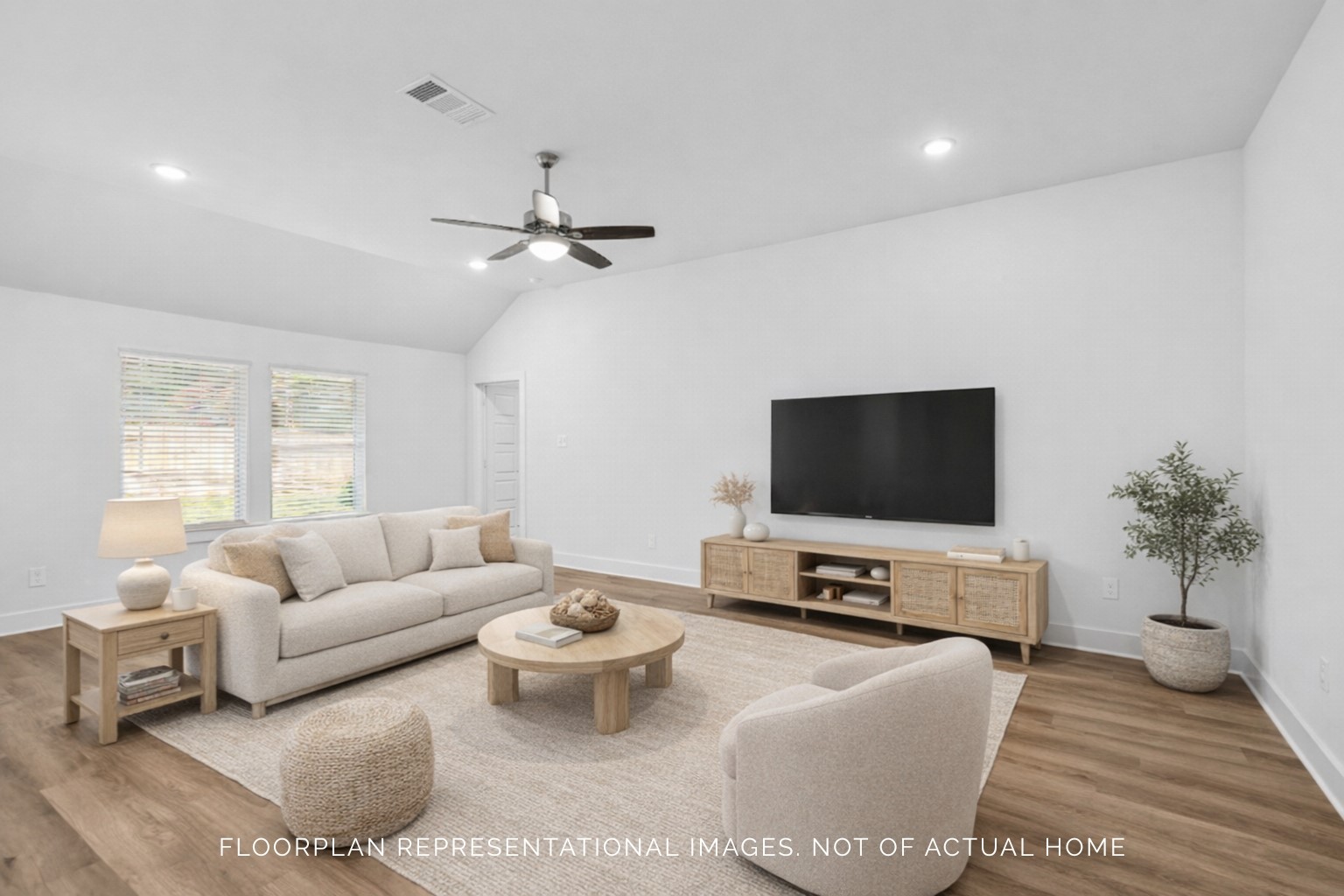 1816 Sleeping Hls Drive Rosenberg, TX 77471 - Photo 12 of 12 a living room with furniture and a flat screen tv