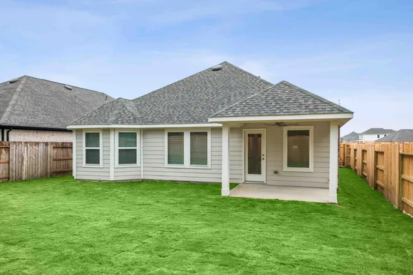 a kitchen with stainless steel appliances kitchen island granite countertop a stove a sink a refrigerator and white cabinets with wooden floor