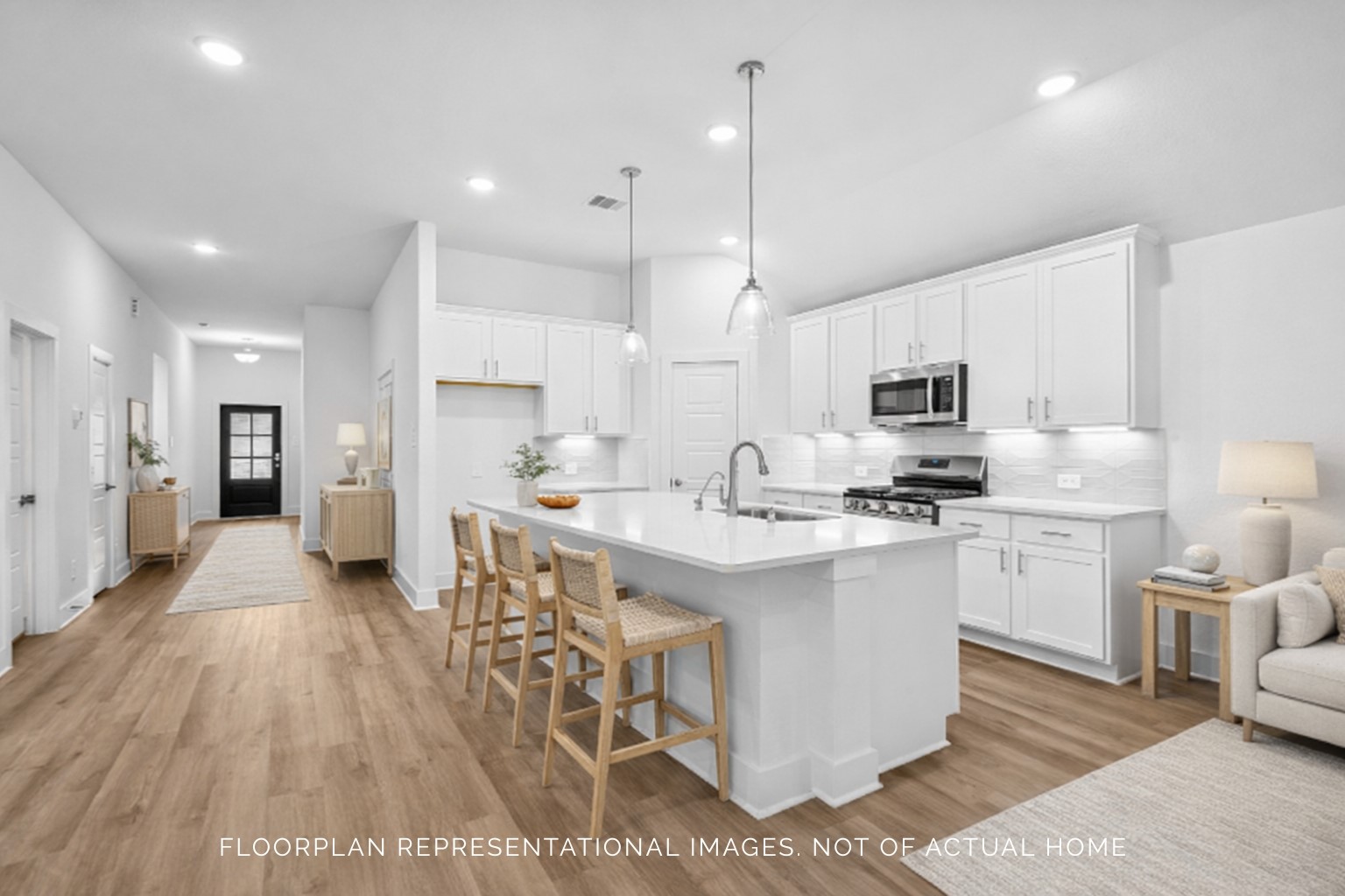 1816 Sleeping Hls Drive Rosenberg, TX 77471 - Photo 5 of 12 a kitchen with stainless steel appliances kitchen island granite countertop a stove a sink a refrigerator and white cabinets with wooden floor