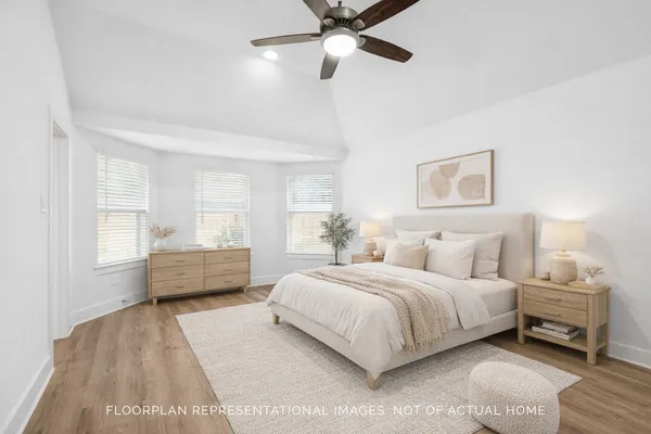 a bedroom with a bed and a desk