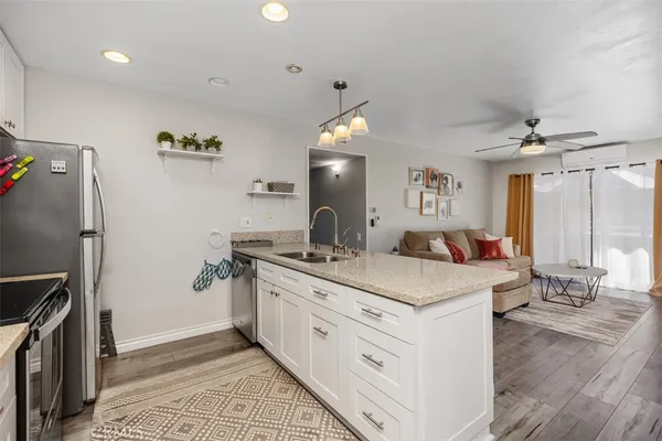 a bathroom with a sink double vanity granite and a mirror