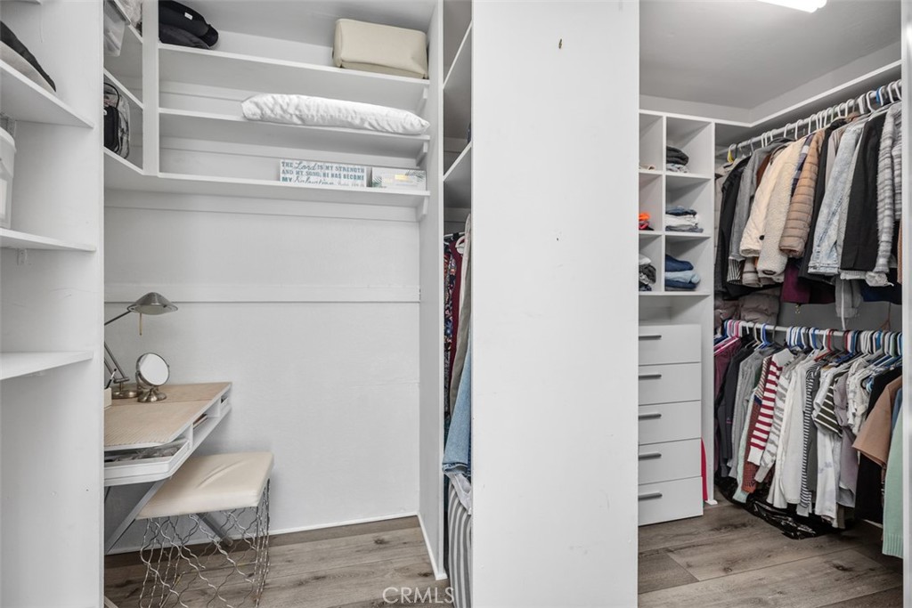 21981 Rimhurst Drive, Unit P160 Lake Forest, CA 92630 - Photo 24 of 35 a view of walk in closet with clothes and shoes