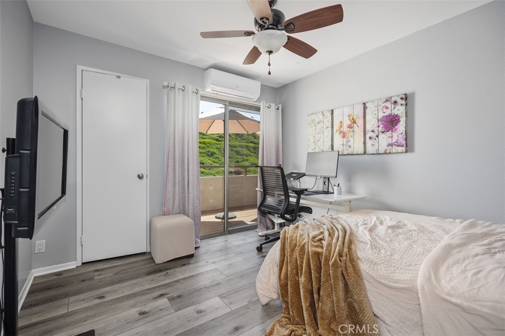 21981 Rimhurst Drive, Unit P160 Lake Forest, CA 92630 - Photo 25 of 35 a bed room with a bed and a chandelier