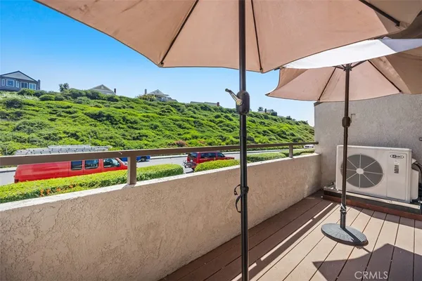 a view of a balcony with wooden floor