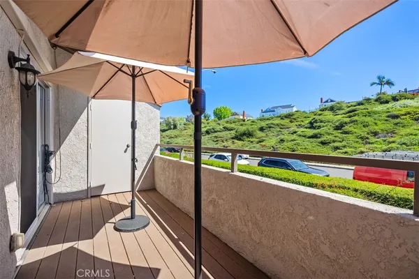 a view of balcony with furniture