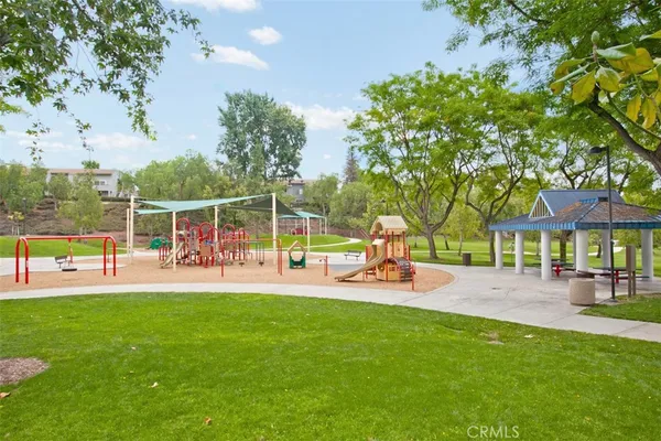 a view of a house with swimming pool and sitting area