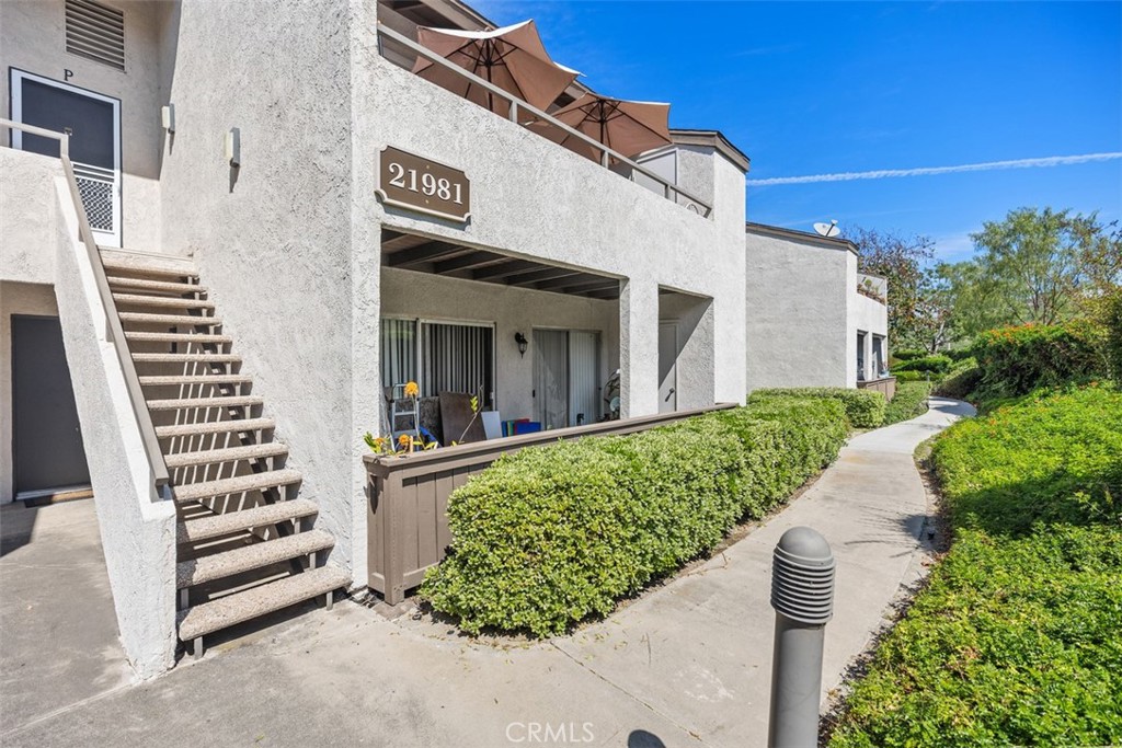 21981 Rimhurst Drive, Unit P160 Lake Forest, CA 92630 - Photo 6 of 35 a view of a house with a yard