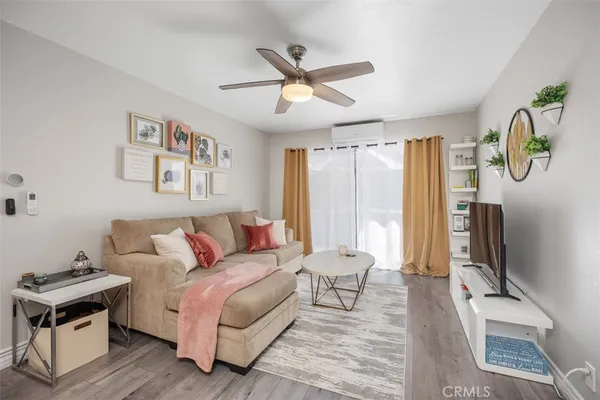 a living room with furniture and a window