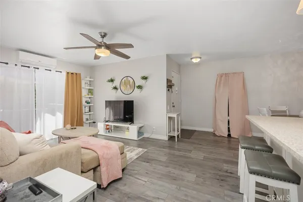 a spacious bedroom with a bed window and a mirror