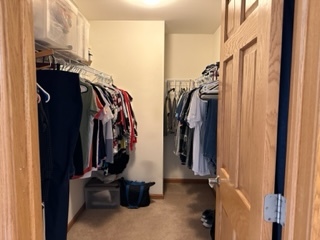 426 Vaughn Circle Aurora, IL 60502 - Photo 12 of 19 a view of walk in closet with clothes