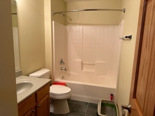 426 Vaughn Circle Aurora, IL 60502 - Photo 14 of 19 a bathroom with a sink a toilet and shower