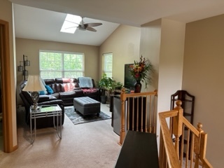 426 Vaughn Circle Aurora, IL 60502 - Photo 16 of 19 a living room with furniture a window and a chandelier