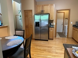 426 Vaughn Circle Aurora, IL 60502 - Photo 4 of 19 a kitchen with stainless steel appliances granite countertop a refrigerator a stove and a sink