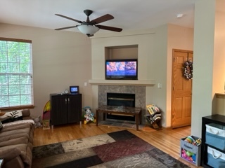 426 Vaughn Circle Aurora, IL 60502 - Photo 5 of 19 a living room with furniture and a fireplace