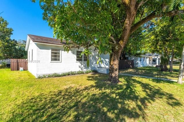358 Pine Court Miami Springs, FL 33166 - Photo 2 of 24 a view of a house with swimming pool