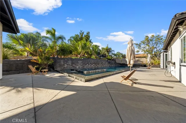 a view of living room with furniture and a window