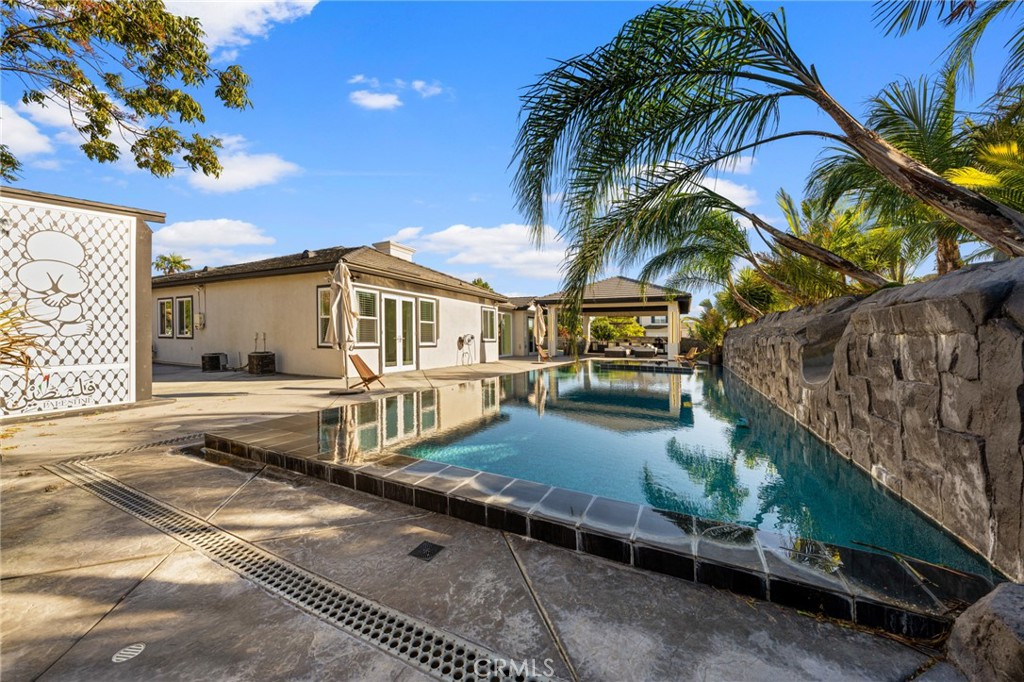6069 Cannich Road Riverside, CA 92507 - Photo 16 of 75 a view of a house with a yard