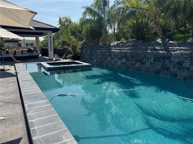 a living room with furniture potted plant and a window