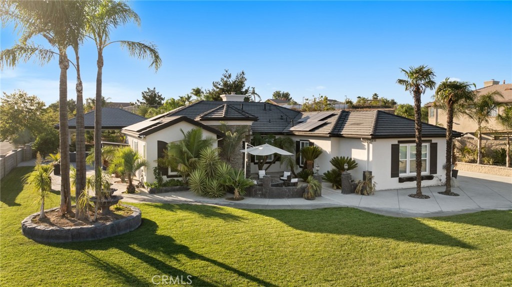 6069 Cannich Road Riverside, CA 92507 - Photo 2 of 75 a view of a house with backyard water fountain and sitting area