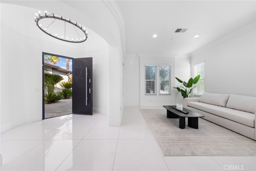 6069 Cannich Road Riverside, CA 92507 - Photo 24 of 75 a living room with furniture a window and a potted plant