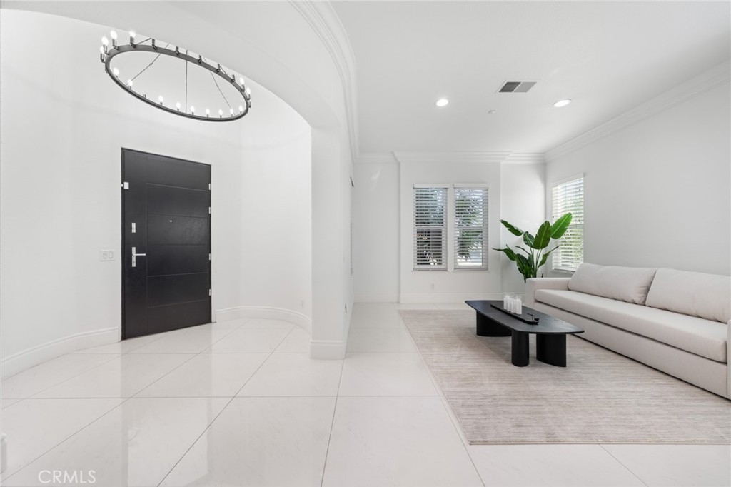 6069 Cannich Road Riverside, CA 92507 - Photo 25 of 75 a living room with furniture a window and a potted plant