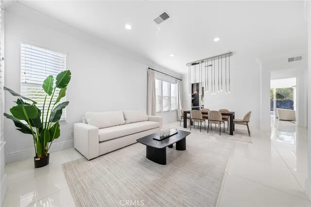 a kitchen with kitchen island a sink stainless steel appliances and cabinets