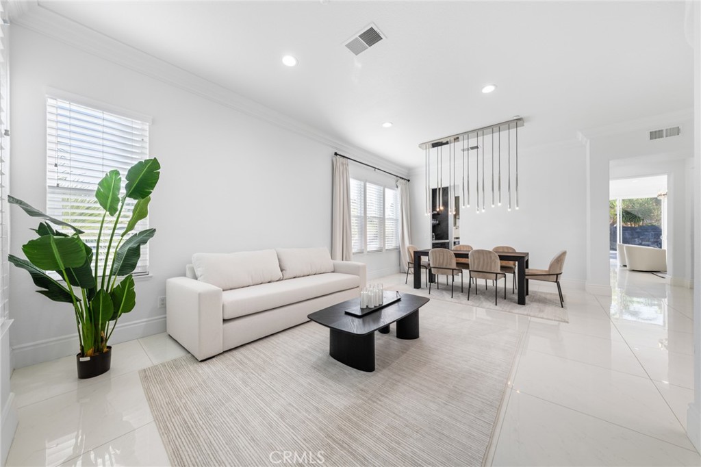 6069 Cannich Road Riverside, CA 92507 - Photo 26 of 75 a living room with furniture potted plant and a window