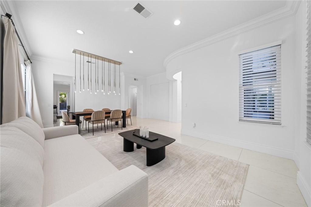 6069 Cannich Road Riverside, CA 92507 - Photo 27 of 75 a living room with furniture and a large window