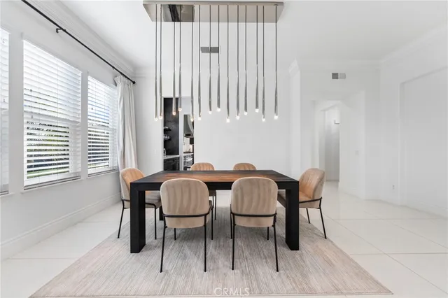 a living room with furniture a window and chairs
