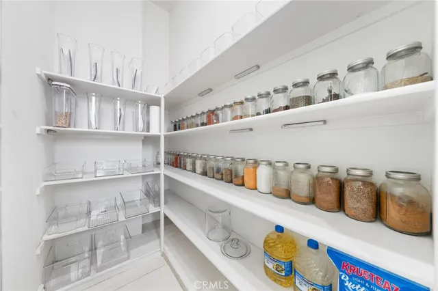 a dining room with furniture and a window
