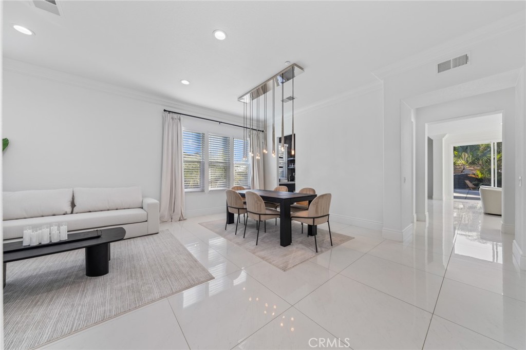 6069 Cannich Road Riverside, CA 92507 - Photo 42 of 75 a dining room with furniture and a window