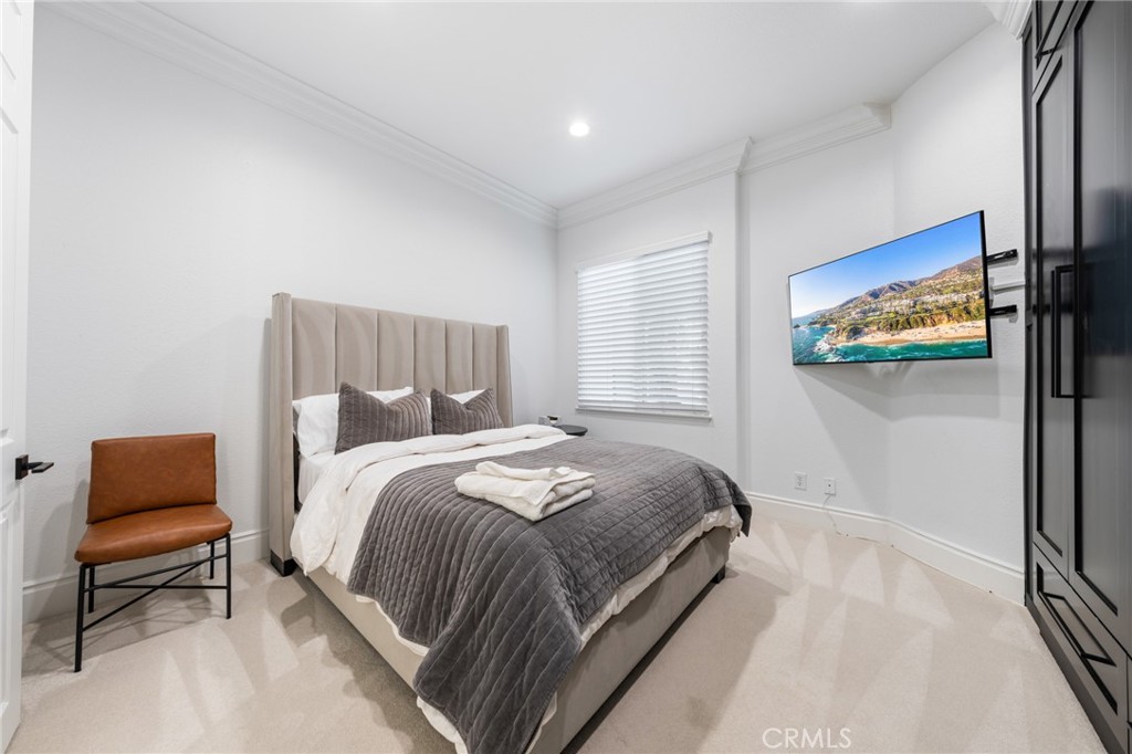 6069 Cannich Road Riverside, CA 92507 - Photo 43 of 75 a bedroom with a bed and a couch