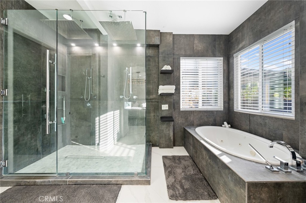 6069 Cannich Road Riverside, CA 92507 - Photo 50 of 75 a bathroom with a tub shower and sink