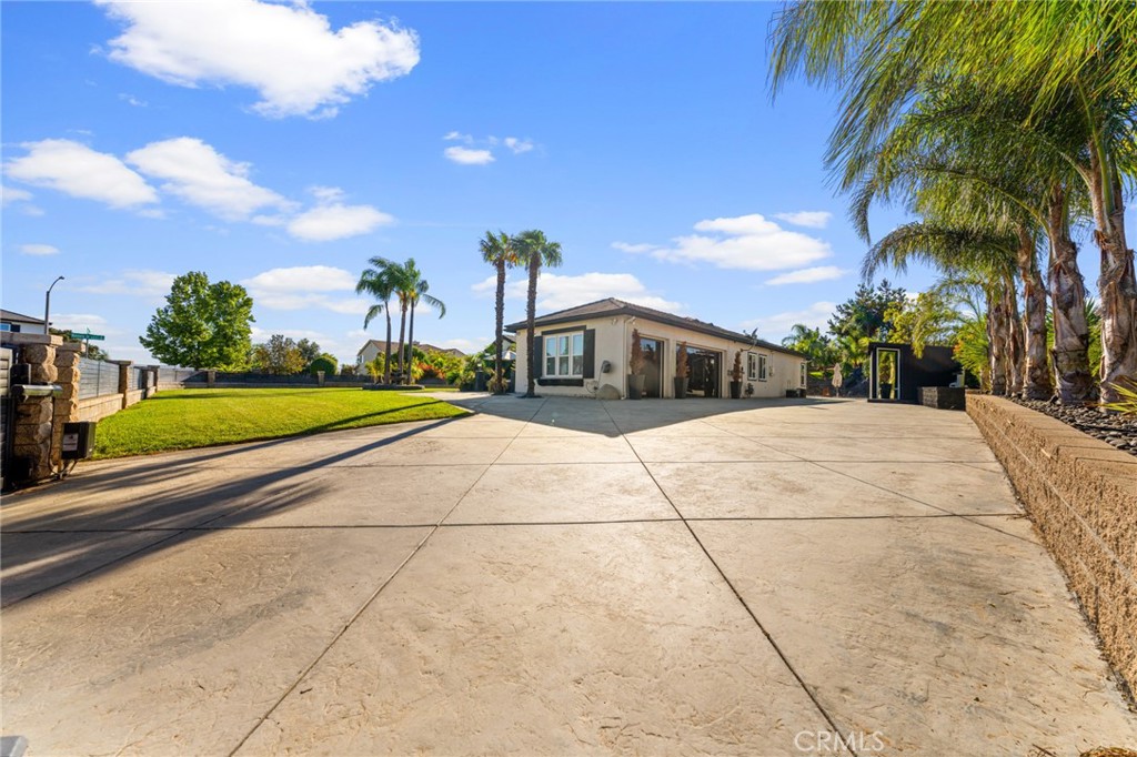 6069 Cannich Road Riverside, CA 92507 - Photo 5 of 75 a front view of a house with garden