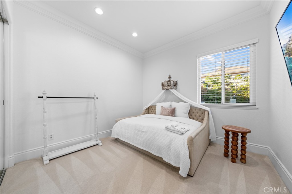 6069 Cannich Road Riverside, CA 92507 - Photo 53 of 75 a bedroom with a bed and a window