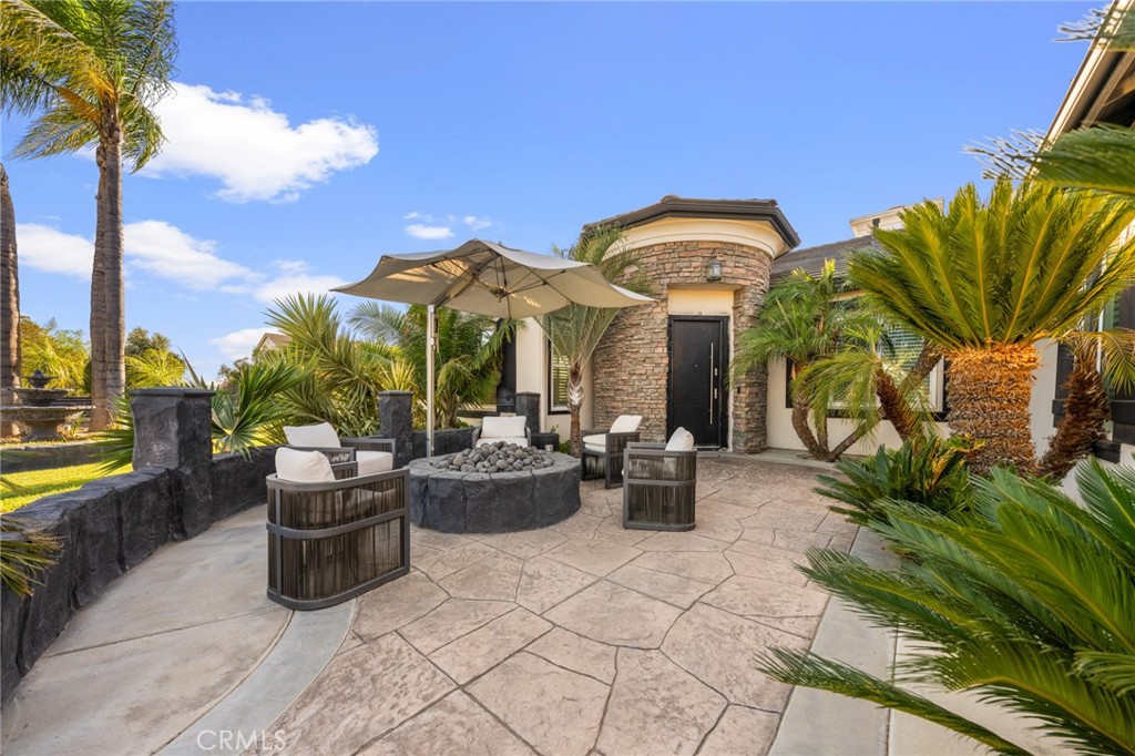 6069 Cannich Road Riverside, CA 92507 - Photo 59 of 75 a view of a patio with couches and potted plants