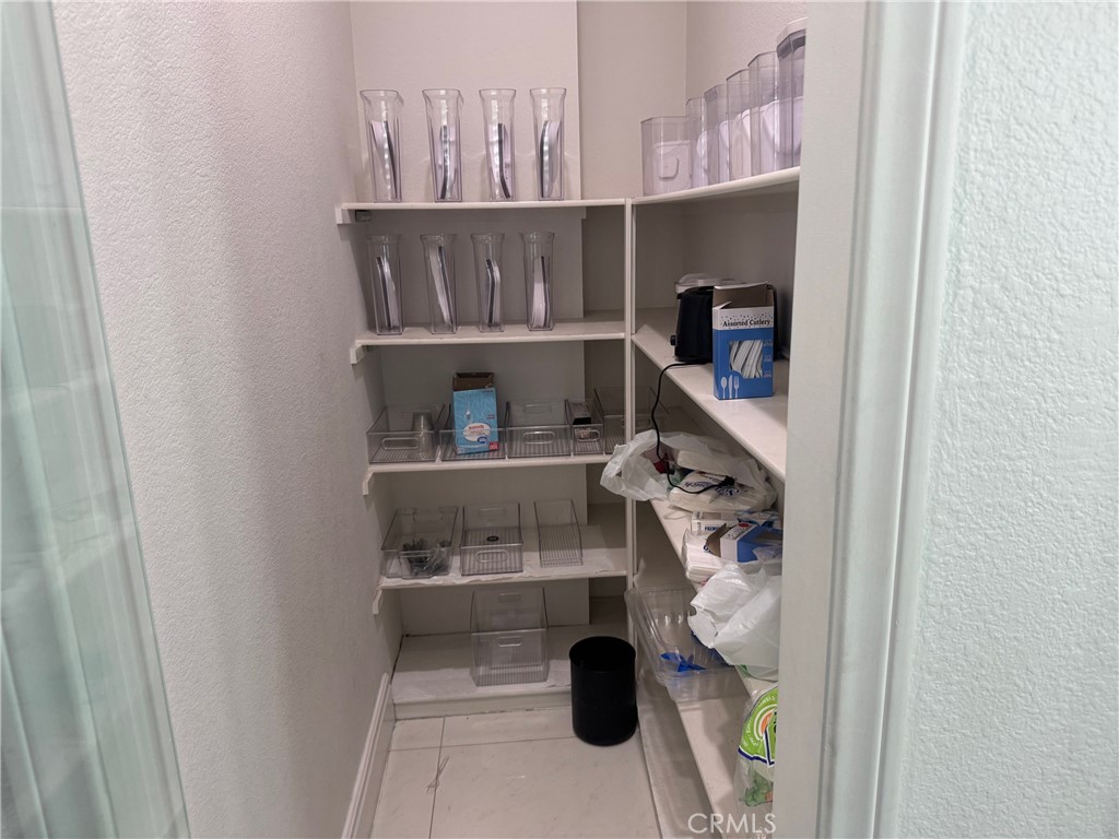 6069 Cannich Road Riverside, CA 92507 - Photo 62 of 75 a view of walk in closet with clothes and shoes