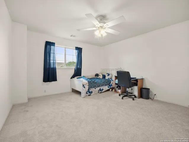 a bed room with furniture and a window