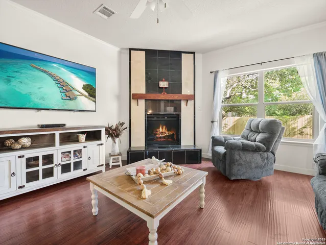 a living room with furniture and a fireplace