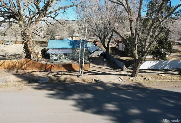 a view of a street with a tree
