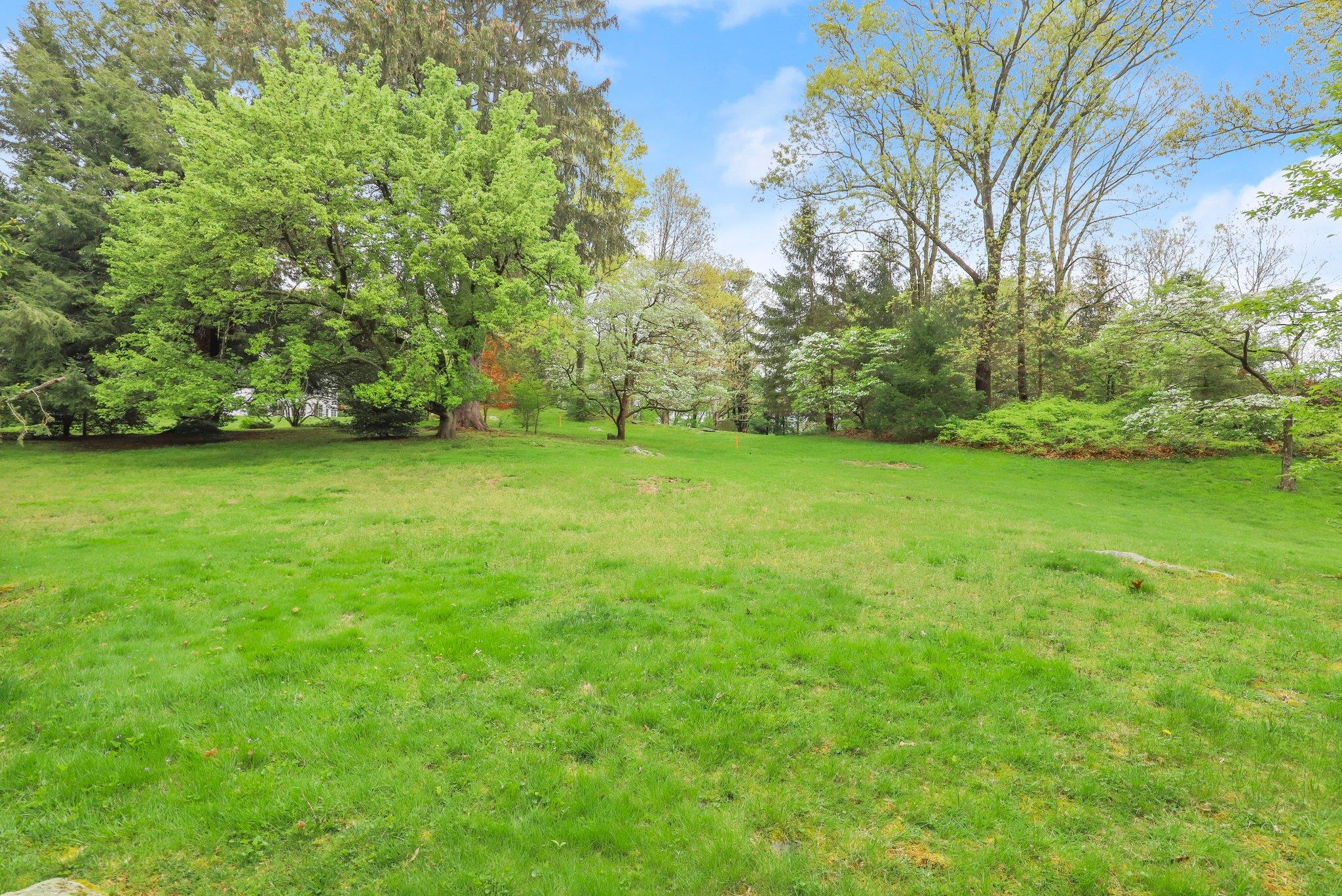 32-4 Orchard Drive Armonk, NY 10504 - Photo 2 of 4 a view of a green yard
