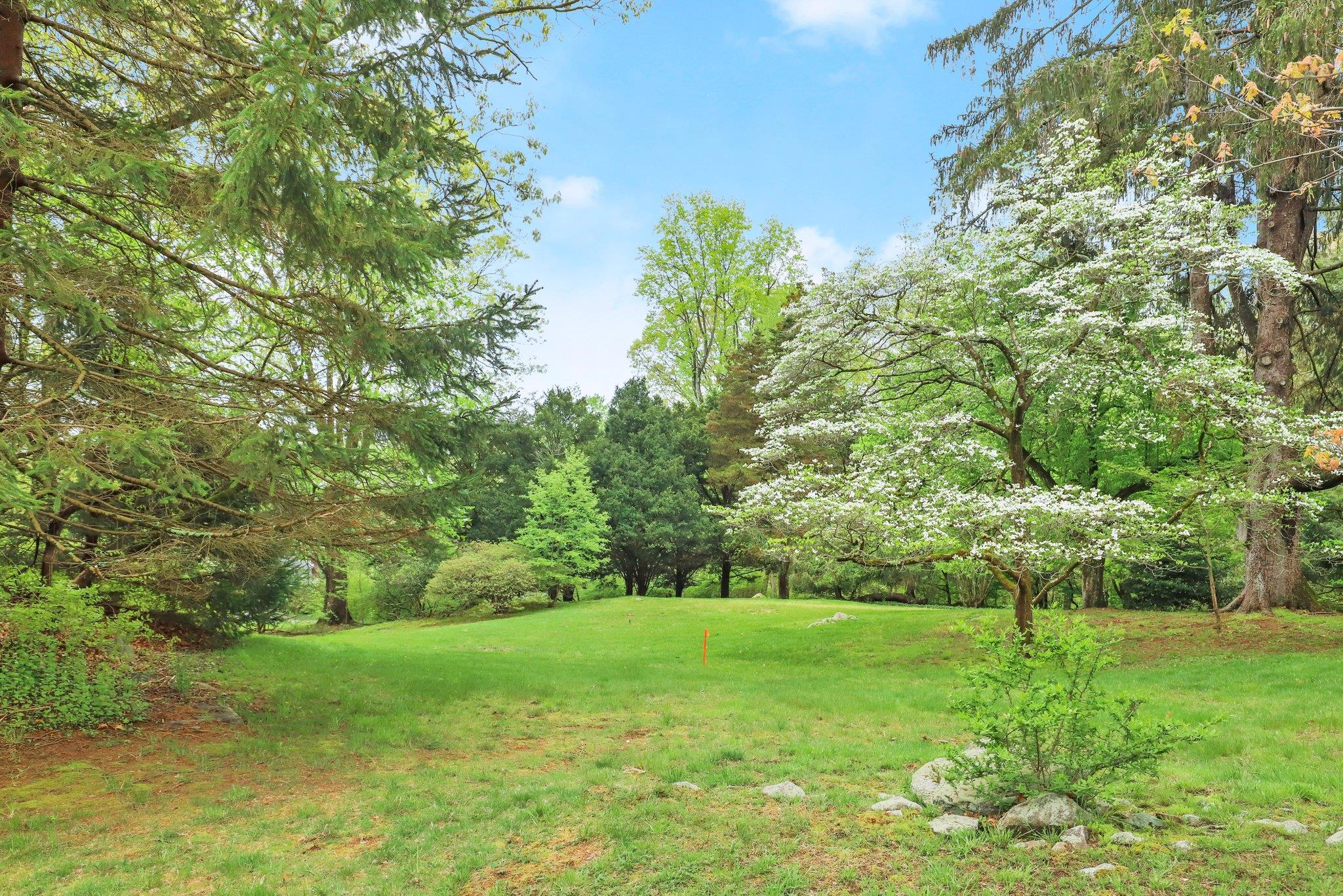 32-4 Orchard Drive Armonk, NY 10504 - Photo 3 of 4 a view of a garden with trees