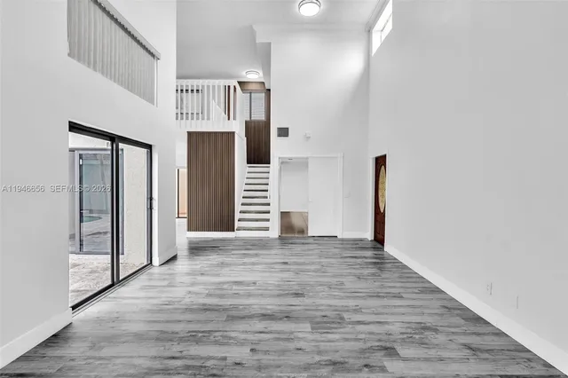 a view of entryway with wooden floor