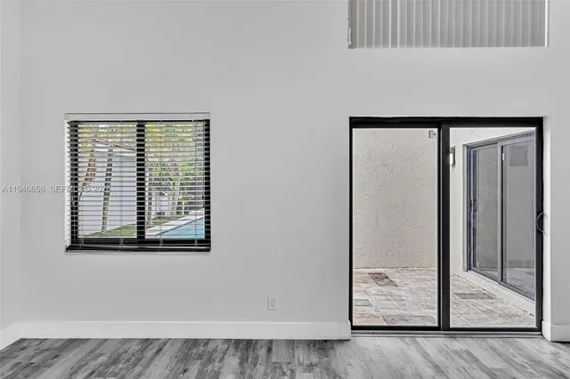 a view of entryway with wooden floor