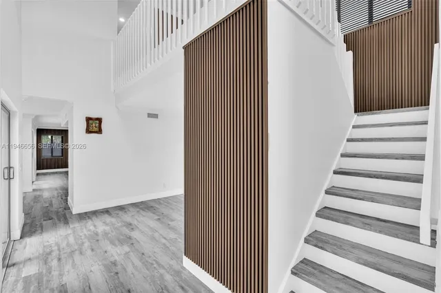 a view of an empty room with glass door