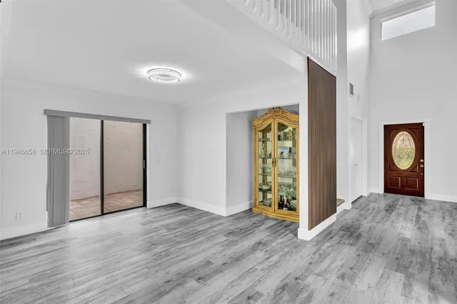 a kitchen with stainless steel appliances granite countertop a stove top oven and sink