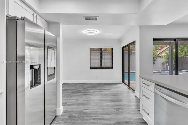 a view of a hallway with windows